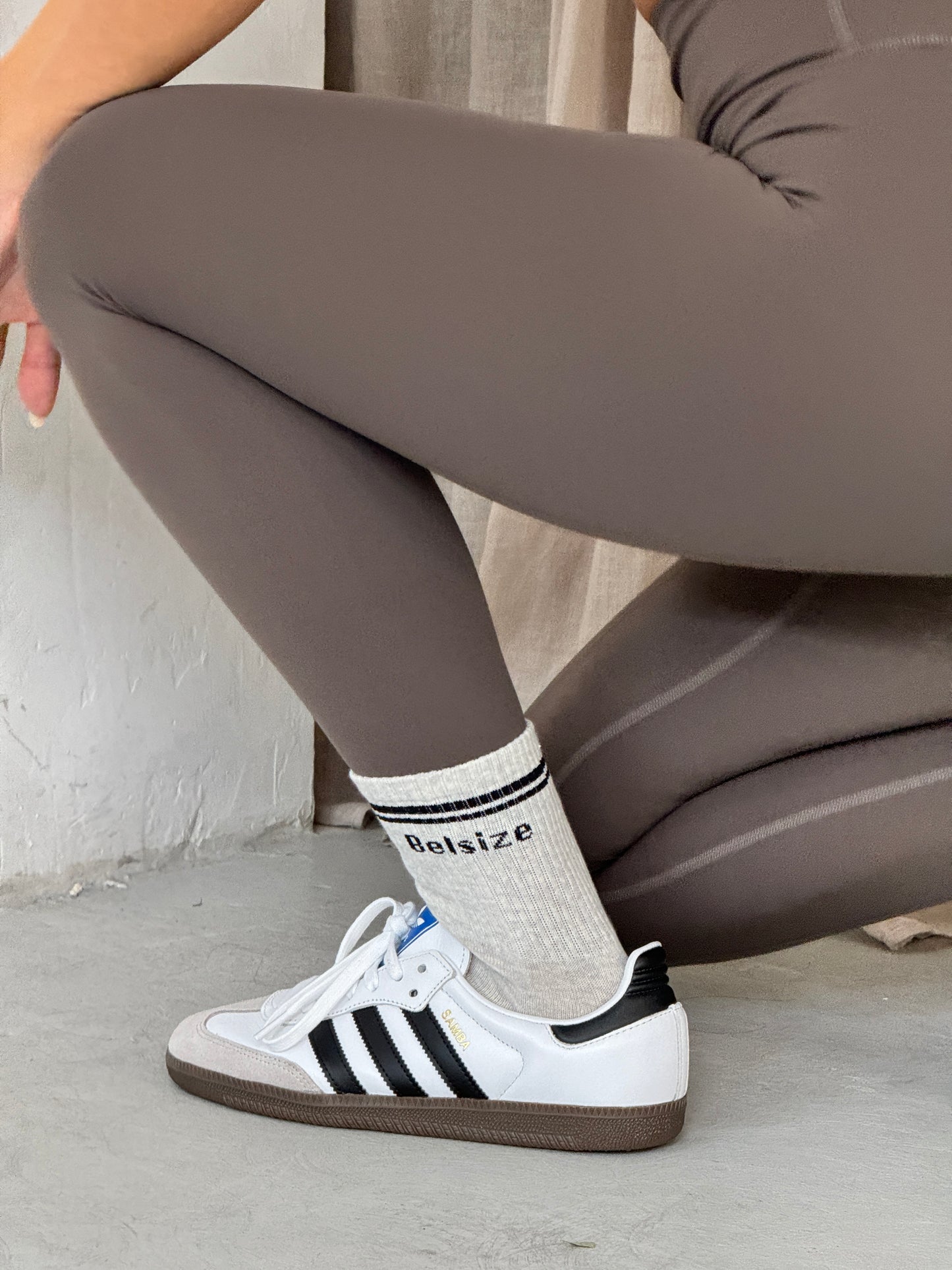 Taupe leggings and sports bra