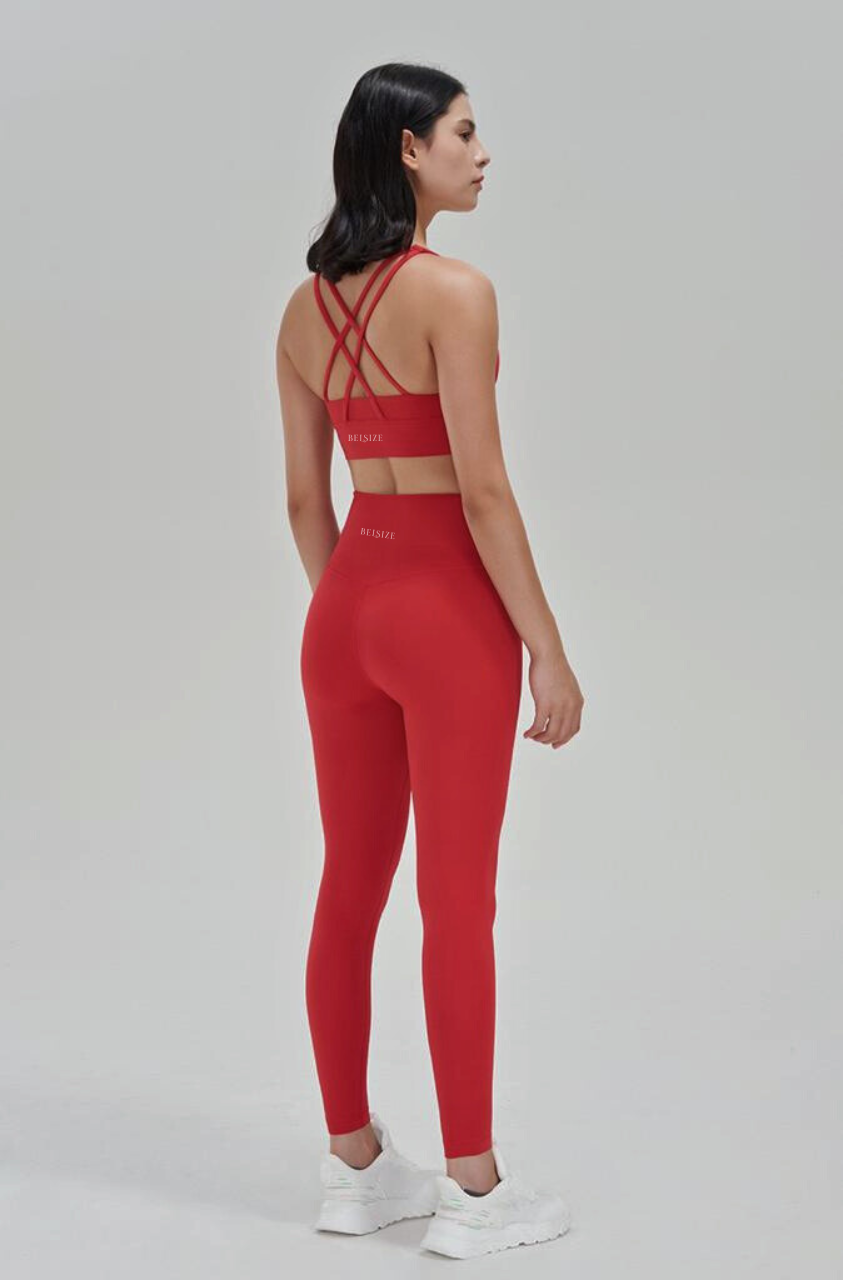 Fashionable red athletic bra and leggings
